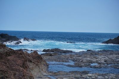 Scenic view of sea against clear sky