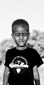 Portrait of boy standing outdoors