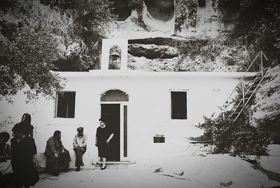 Woman standing against wall