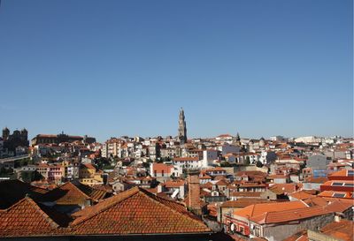 Cityscape against clear blue sky