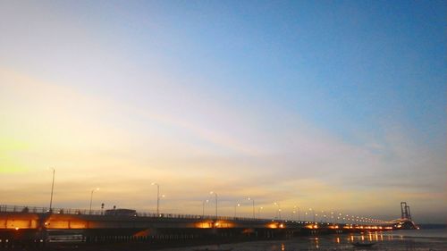 View of illuminated city at sunset