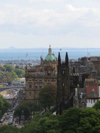 Panoramic view of buildings and city against sky