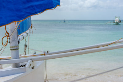 Close-up of beach against sky