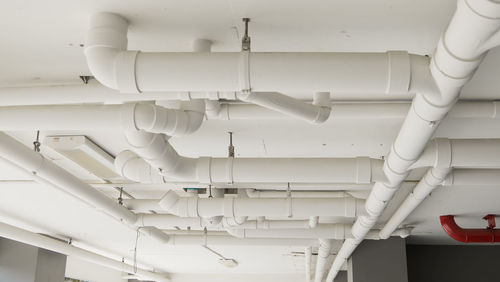 Low angle view of clothes hanging on ceiling