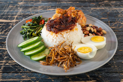 Nasi lemak is a malay fragrant rice dish cooked in coconut milk and pandan leaf.