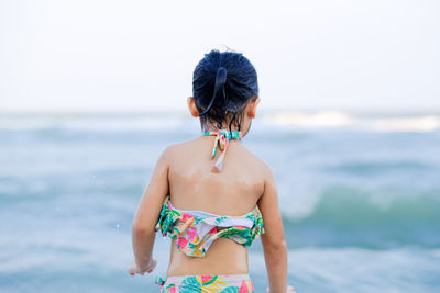 Rear view of woman on beach