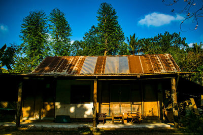 Abandoned house against blue sky