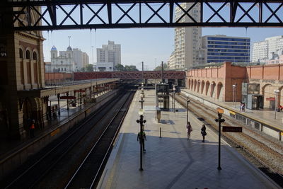 High angle view of railroad tracks in city against sky