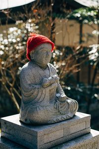 Close-up of statue against tree