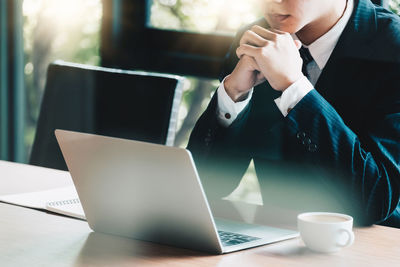 Man using laptop on table