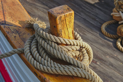 Close-up of rope tied on wooden table