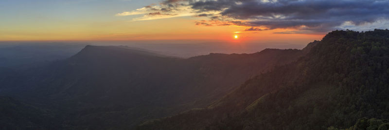 Scenic view of mountains against sky during sunset