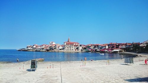 View of sea against clear blue sky