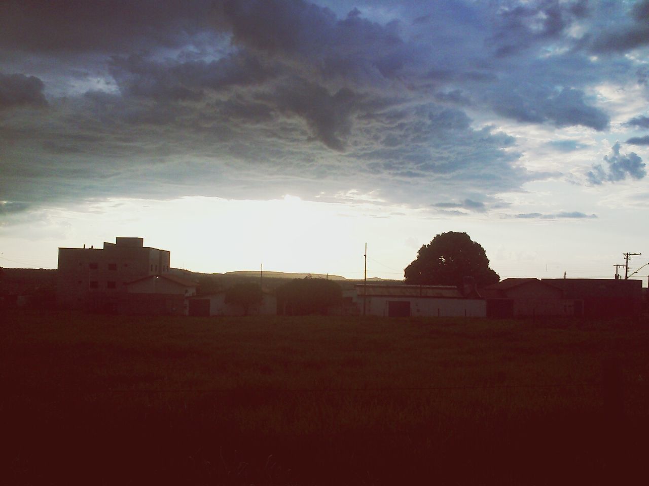 building exterior, architecture, built structure, sky, cloud - sky, sunset, cloudy, house, silhouette, cloud, residential structure, residential building, landscape, dusk, field, weather, nature, outdoors, no people, building