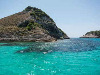 Scenic view of sea against clear blue sky