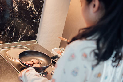 Midsection of woman having food