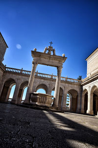 Low angle view of historical building against blue sky