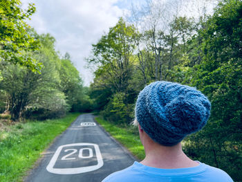 Rear view of woman wearing a knit hat