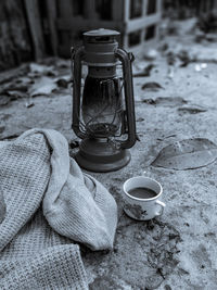 High angle view of man holding coffee on table