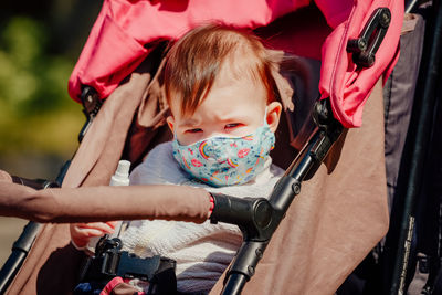 Cute baby girl sitting in park