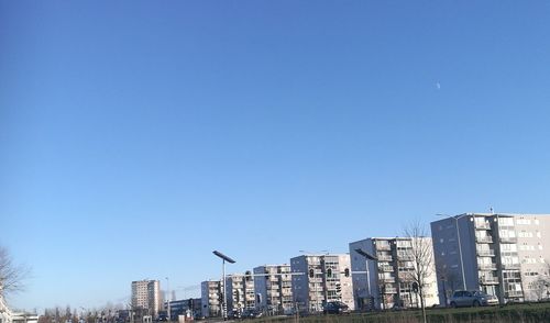 View of skyscrapers against blue sky