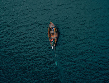 High angle view of person sitting in boat on sea