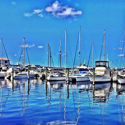 Boats moored at harbor