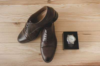 High angle view of shoes on wooden floor