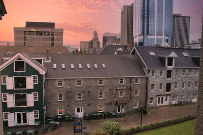 High angle view of buildings against sky during sunset