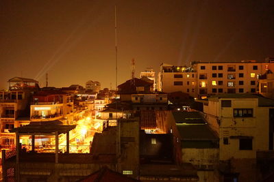 Buildings in city at night