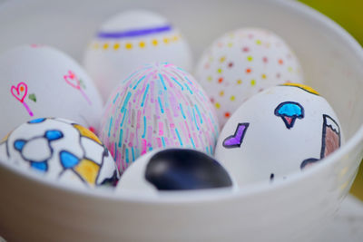 Close-up of multi colored candies in bowl on table