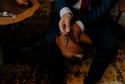 Low section of man sitting on floor