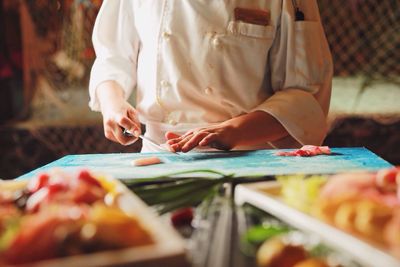 Chef slicing fish