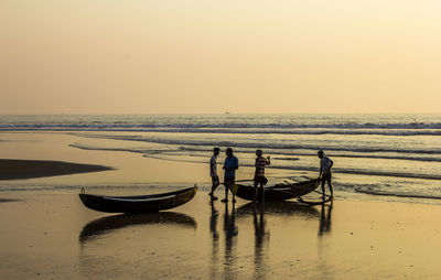 Scenic view of sea against sky at sunset