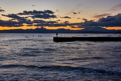 Scenic view of sea against sky during sunset