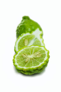 Close-up of green pepper against white background