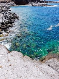 High angle view of pebbles on beach