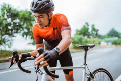 Man riding bicycle on street