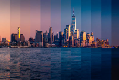 Illuminated buildings in city against sky