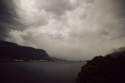 Scenic view of sea against cloudy sky