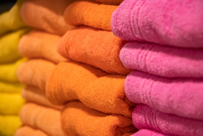 Sale of soft bath towels in the store. stack of spa accessories.