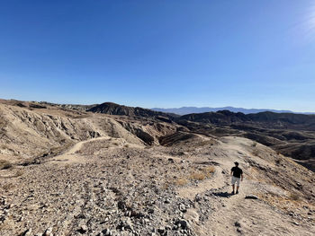 Scenic view of arid landscape against clear sky