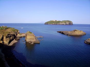 Scenic view of sea against clear blue sky