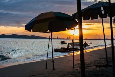 Scenic view of beach against sky during sunset