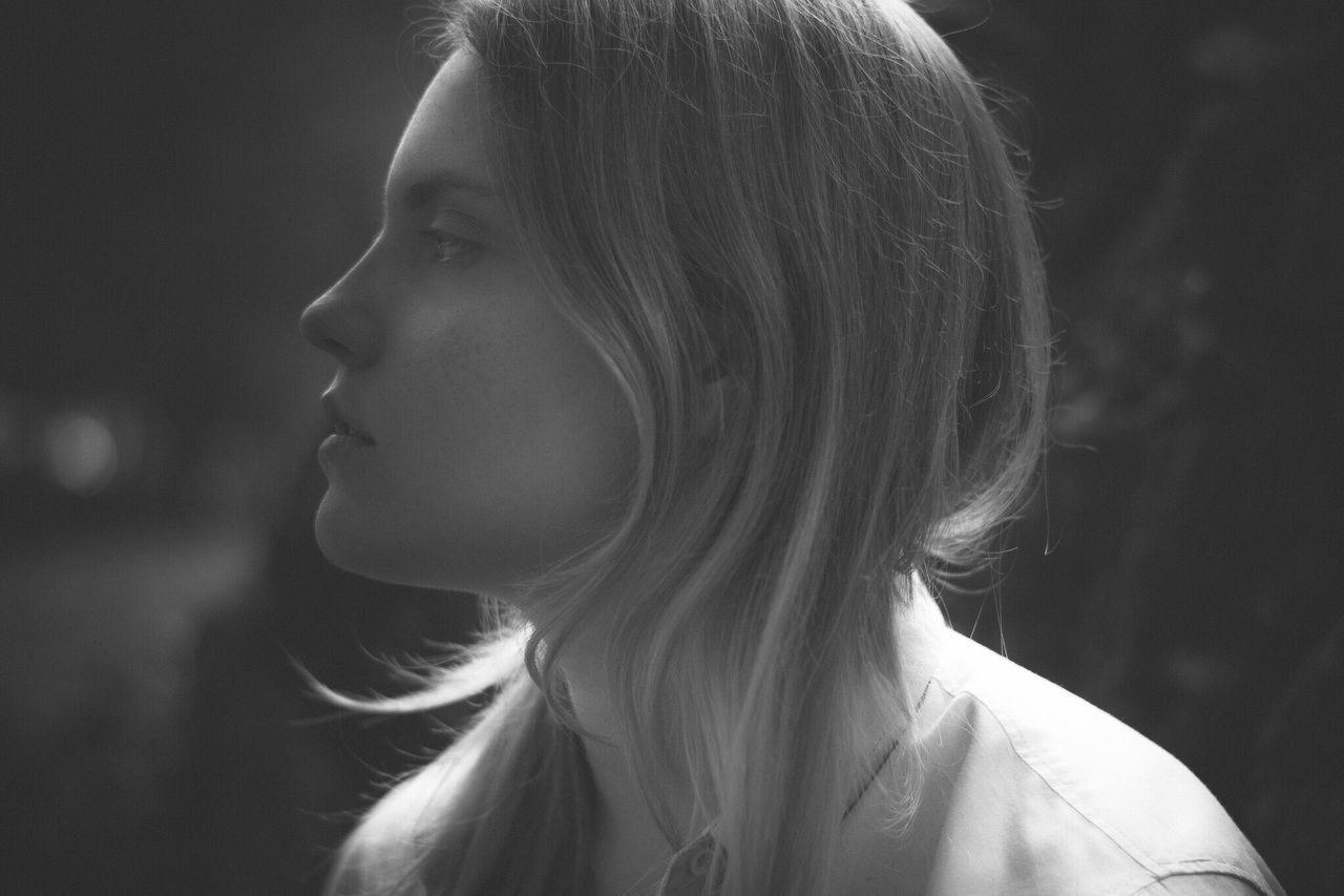 headshot, lifestyles, person, young adult, leisure activity, close-up, young women, contemplation, head and shoulders, studio shot, indoors, casual clothing, human face, side view, front view, focus on foreground, long hair, looking away