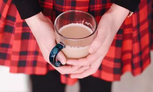 Close-up of woman holding drink