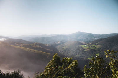 Overhead view of mountains landscape with fog above