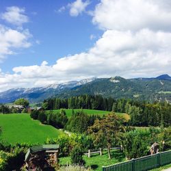 Scenic view of mountains against cloudy sky