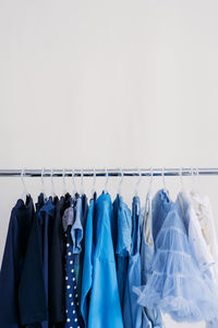 Clothes hanging on rack against wall