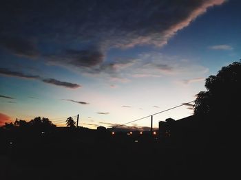 Low angle view of silhouette trees against sky during sunset